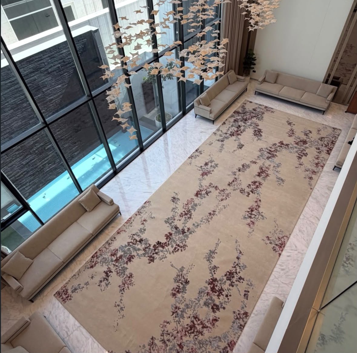 Bespoke carpet in a bright double-height interior